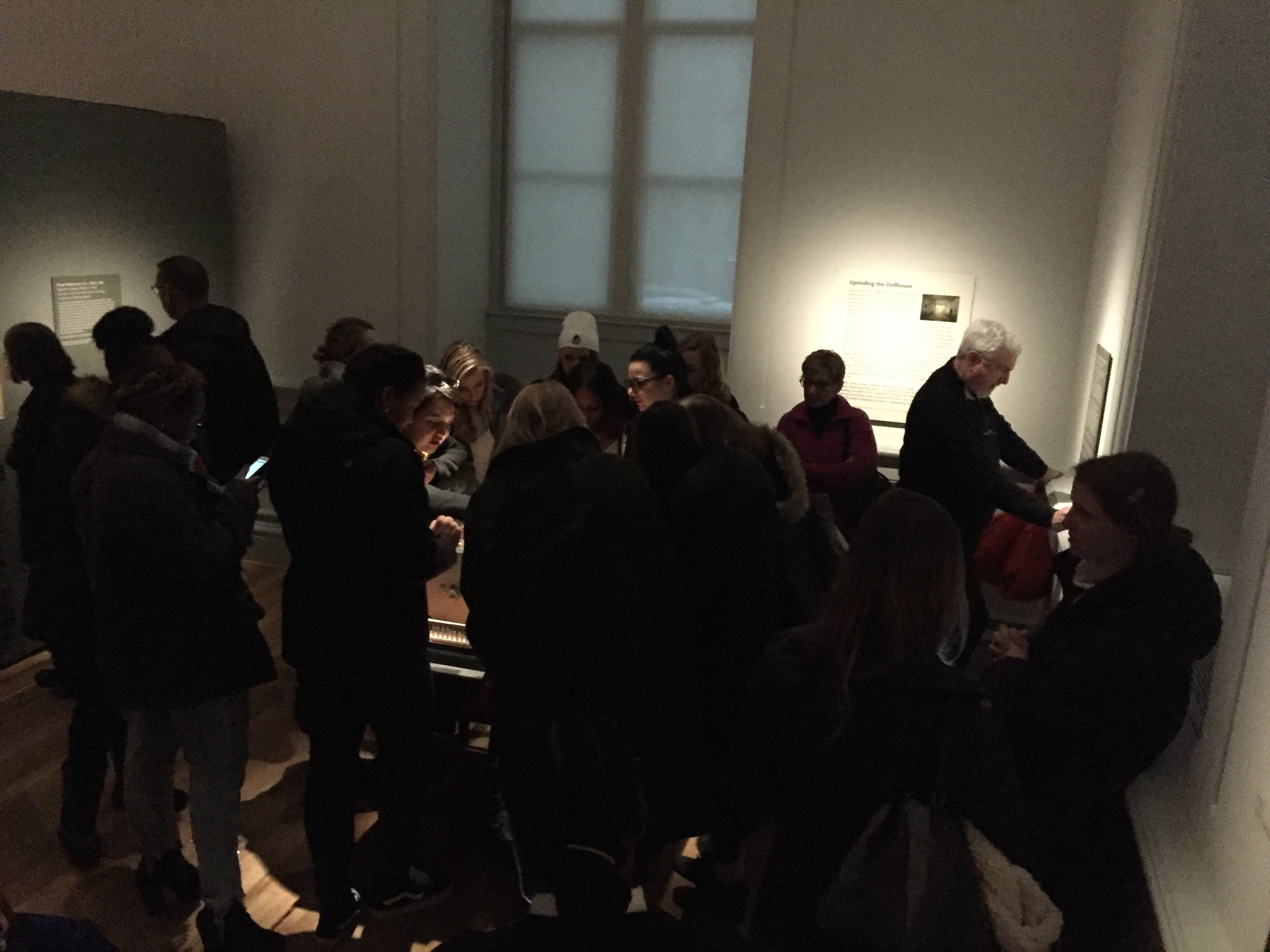 A group of strangers at the Renwick Gallery puzzling out one of Lee's forensic "nutshell" studies, Dec. 9, 2017